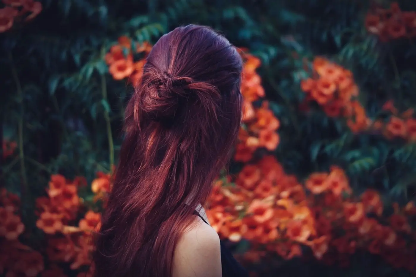 Woman with long burgundy-red hair