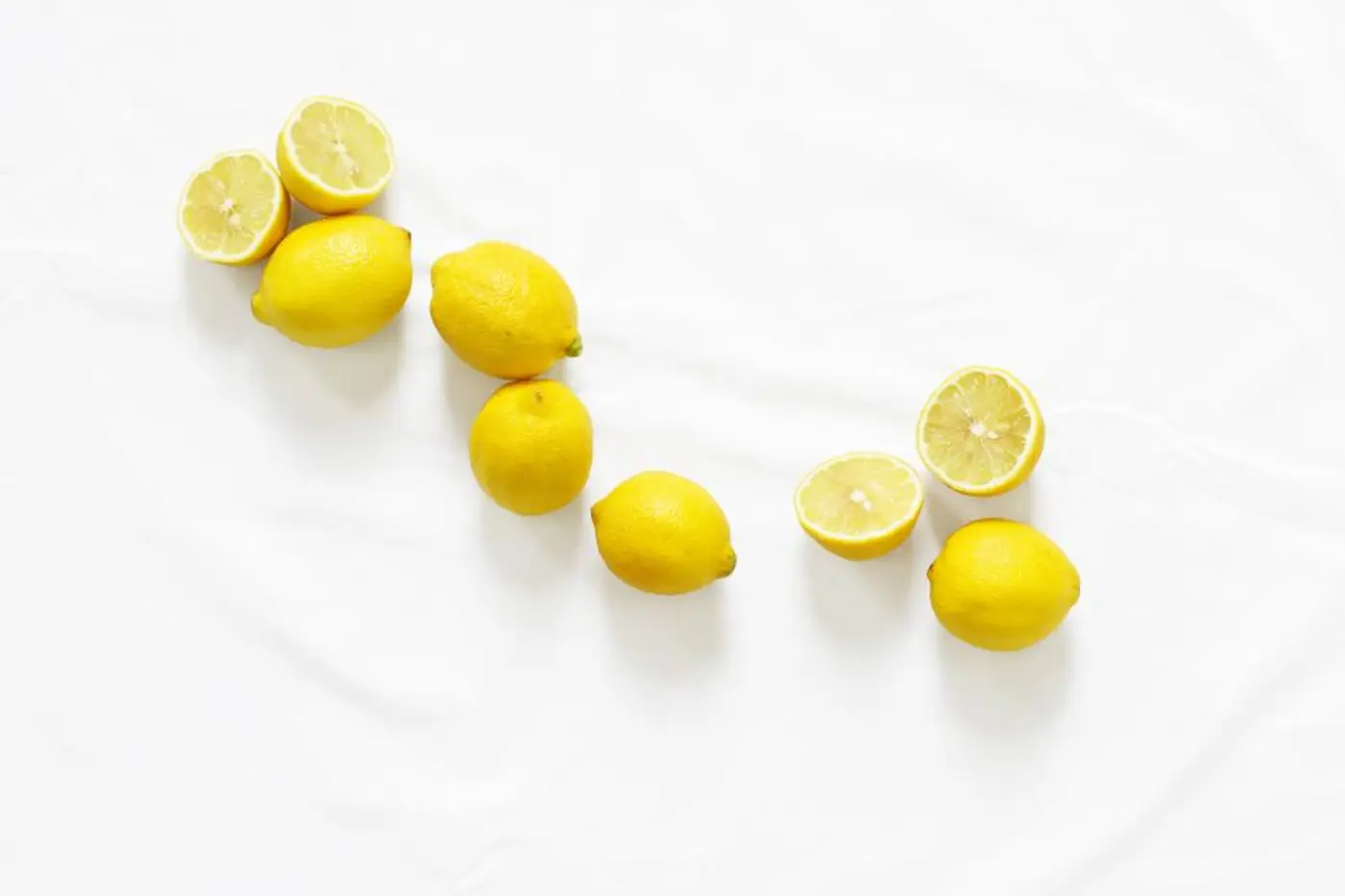 Fresh lemons on a white cloth