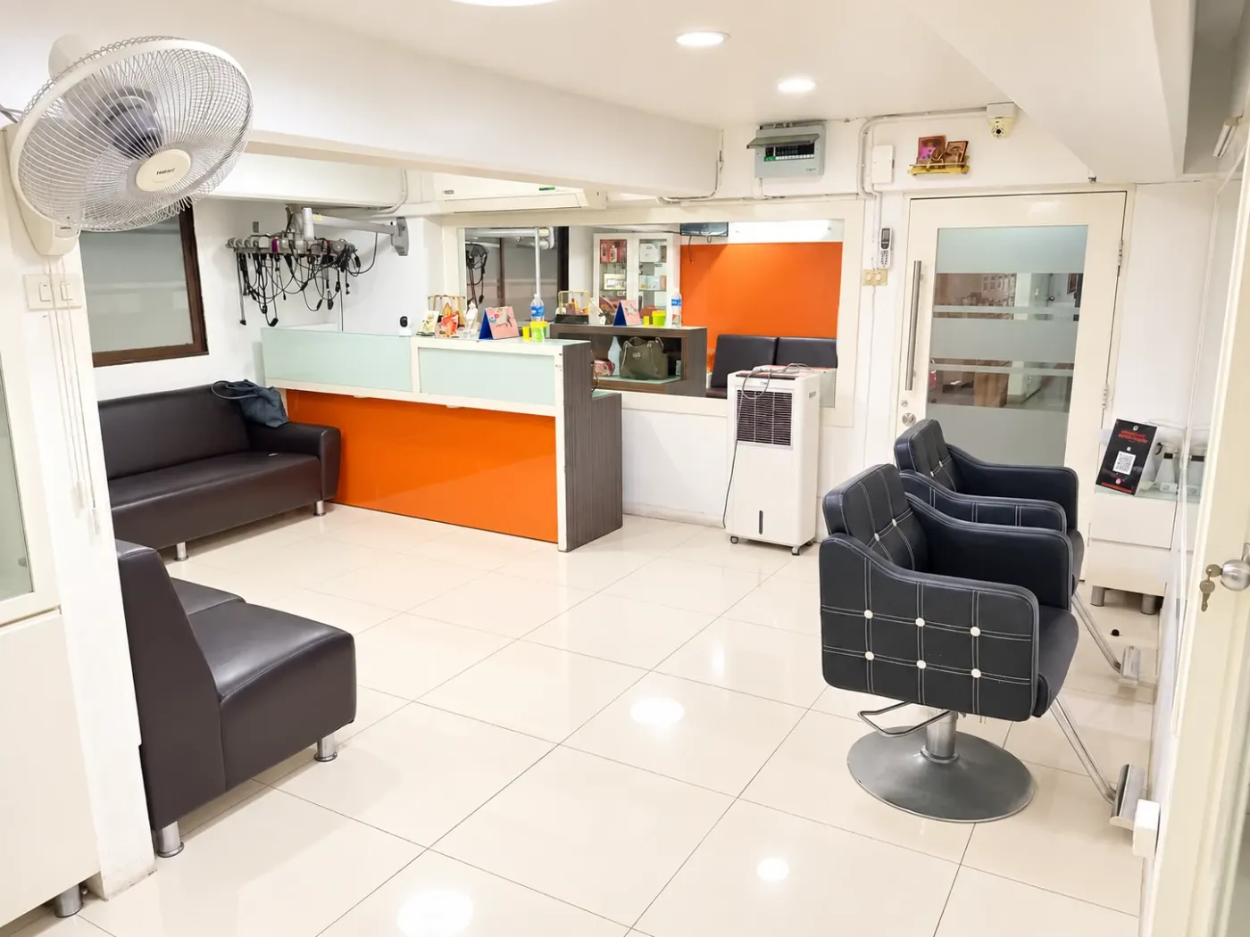 Inside Sai Meher Indian Beauty Salon: reception, waiting sofas and styling chairs